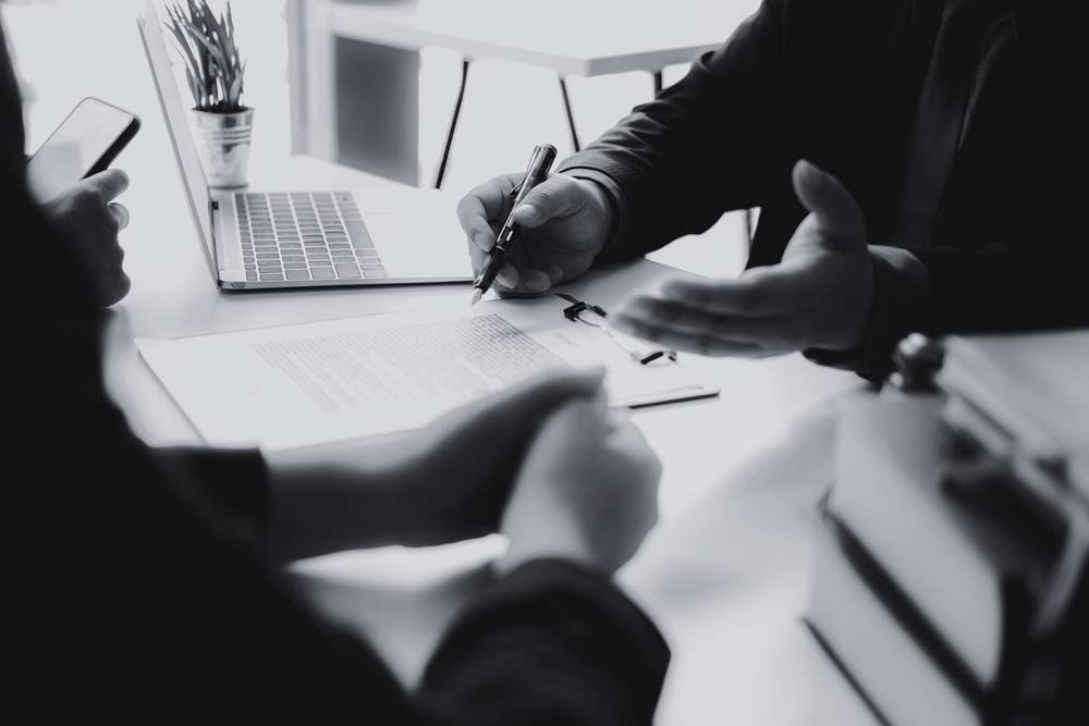 Business meeting reviewing a contract